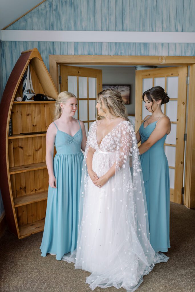 Bride getting dressed at her Sherwood Inn Wedding by Photographer Maranda Elysse Photography