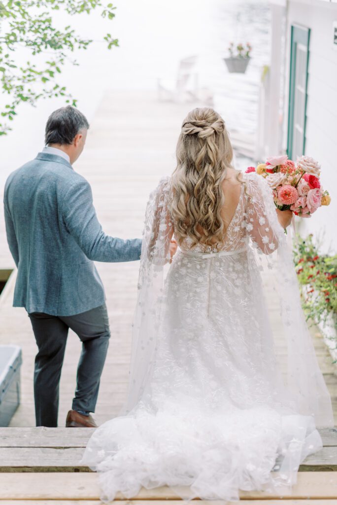 Couple walking onto dock at the Sherwood Inn.