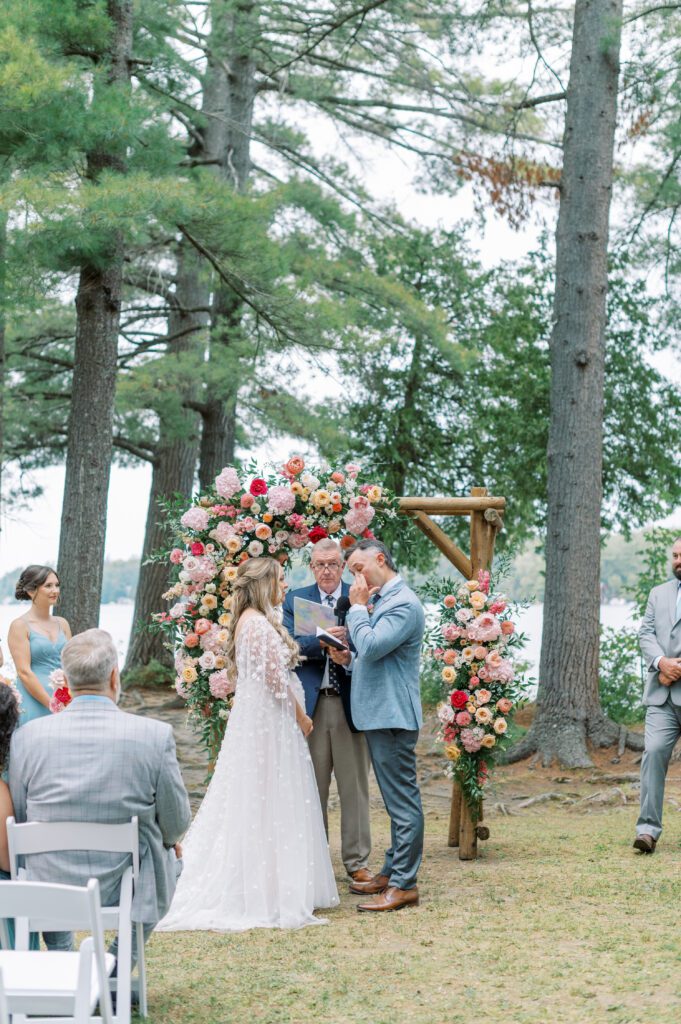 Emotional groom during wedding ceremony in Muskoka.