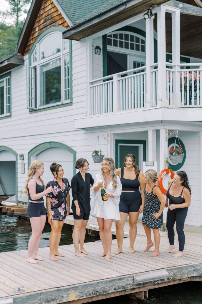 Muskoka Wedding Photographer wedding morning with bridal party on dock.