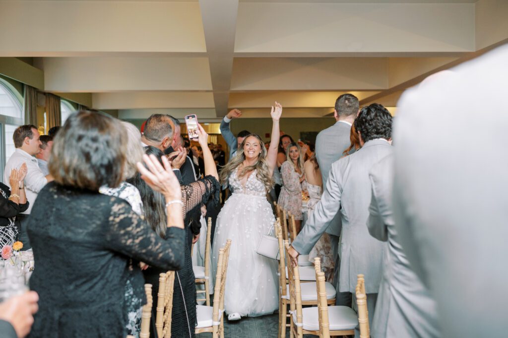 fun entrance into reception by bride and groom.